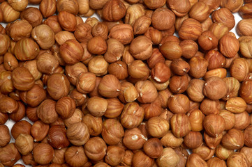 Nut background of hazelnut fruits. Food background. Top view of hazelnut nuts