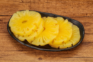Marinated pineapple rings in the bowl