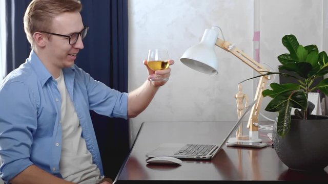 Young Businessman Celebrating Drink Wine Online Internet Meeting Team. Conference By Video Call. Working Remotely. Man Chatting Colleagues Camera. Home Quarantine, Social Distancing, Self Isolation..