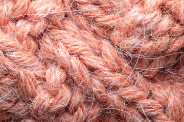 pink knitted background. texture knitted. handmade work.