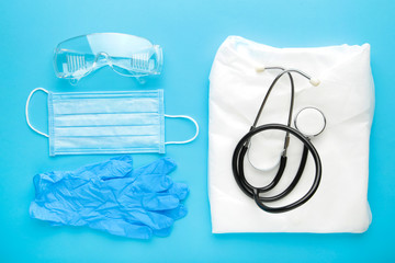 Gloves, mask, gown and safety glasses for personal protection. Coronavirus