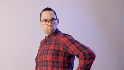 Attractive man feignedly indignant. Portrait of an emotional indignant man. Powerful emotions.