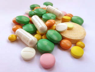 Stack of colourful pills, medicine background