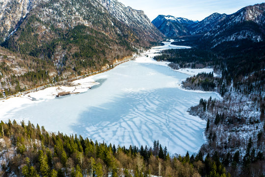 Germany, Bavaria,?Reit?im?Winkl, Helicopter view of?frozen lake in winter valley of Chiemgau Alps