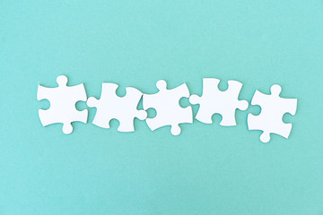 Jigsaw puzzle pieces in a row for inscription, 5 pieces