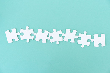 Jigsaw puzzle pieces in a row for inscription, 7 pieces