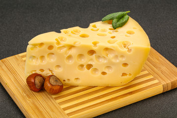 Maasdam cheese - yellow triangle with holes
