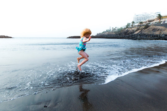Boy playing at the seafront, Adeje, Tenerife, Canarian Islands, Spain