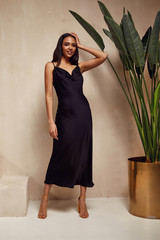 Pretty beautiful woman brunette hair natural makeup wear fashion clothes sexy black silk long dress midi style date party walk  interior studio stairs art chair flowerpot summer journey romantic.