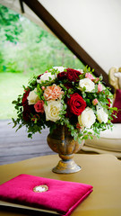 a large bouquet of roses in a vase in vintage style