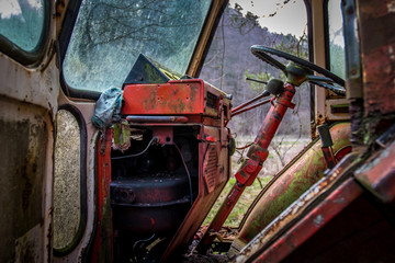 An old abandoned tractor in a former military area