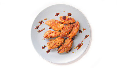 Chicken nuggets in blue plate.