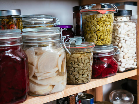 Canned vegetables (beans, beets) in a pantry