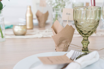 light decor of a festive table in a bright interior