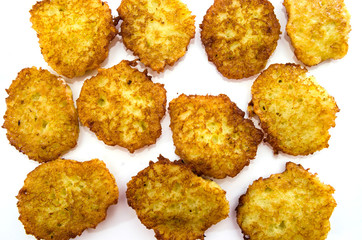 many potato pancakes on a white background. Food Background. View from above.