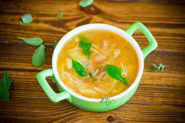 spring soup with vermicelli, vegetables and herbs