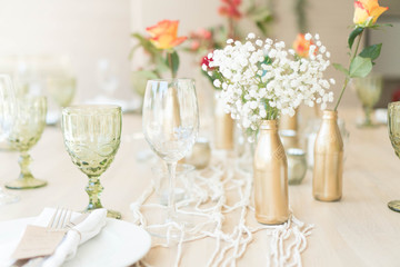 light decor of a festive table in a bright interior