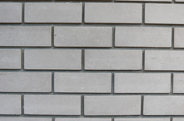 Texture of white brick wall with cement mortar. Background of silicate brick in the form of flat brickwork