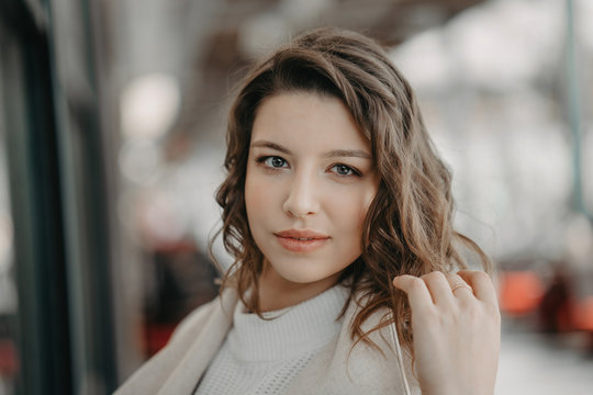 Beautiful young brunette girl close portrait looking in camera