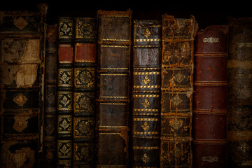 Collection of different old books as background.