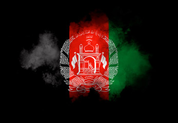 Afghan flag performed from color smoke on the black background. Abstract symbol.