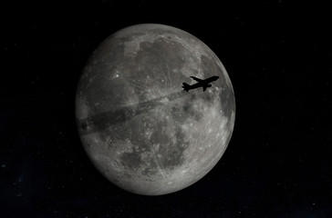 Airplane flying across a full moon.