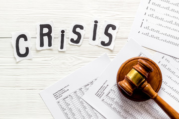 Financial crisis concept with gavel - debt, bankruptcy - on white wooden background top view
