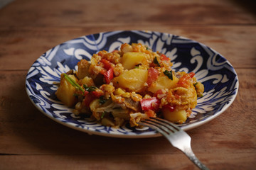 Delicious stew of potatoes, peppers, cauliflower, carrots, onions and green parsley.
