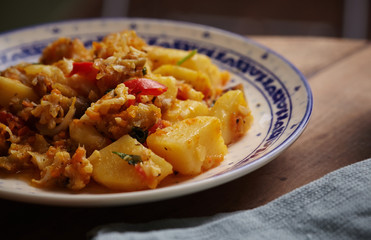 Delicious stew of potatoes, peppers, cauliflower, carrots, onions and green parsley.