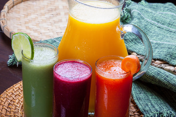 juice jar with glasses and assorted juices