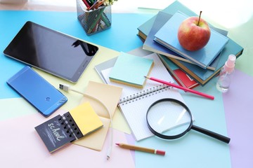 School stationery, tablet, phone on the desk, home schooling concept, part interior children's room, back to school