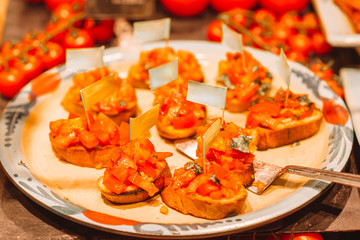 Tasty italian bruschetta on the wooden plate