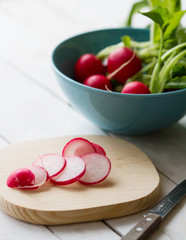 radishes on a wooden board