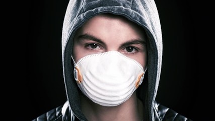 2D Image to 3D Animation Teen boy wearing medical face mask to health protection from influenza virus, on black background. COVID-19 - home self isolation. Concept of coronavirus quarantine. - Powered by Adobe