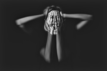 Woman having panic attack on dark background