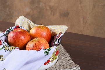 natural and healthy tropical fruit apple in the bowl on the table on blurred texture background