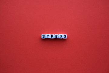 Stress word on a red background
