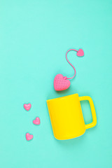 Flat lay with heart shaped tea bag and cup. Waking up, morning tea, every day rituals, zen attitude, destress, healthy drink, love idea