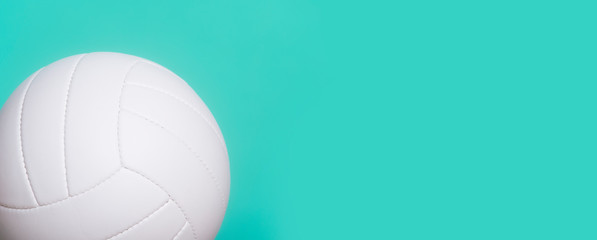 White leather volleyball detail on mint color background