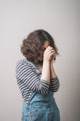 Closeup portrait of a young woman praying