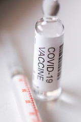 Covid-19 vaccine vial and syringe