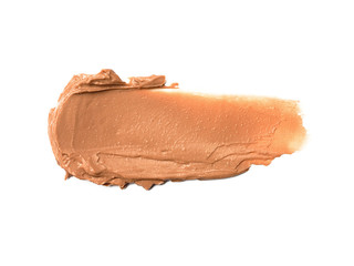 Creamy foundation smeared on white background. Isolated