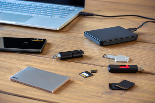 Various digital data storage devices. Usb sticks, external hard drive, SD cards, mini and micro SD cards, laptop and smartphone 