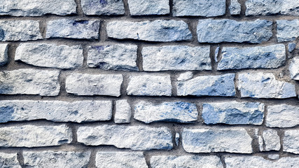 Blue and white brick wall texture background.