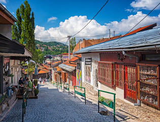 Fototapeta na wymiar SARAJEVO, BOSNIA AND HERZEGOVINA - 3 AUGUST, 2019: Narrow street in the Old town of Sarajevo.