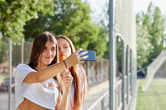 Female teenagers taking a selfie
