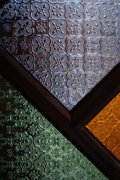 Pattern of Geometric Mosaic Texture on the Glass in Three Colors