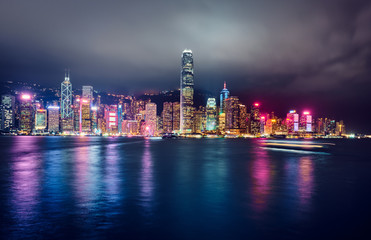 View of Victoria Harbor and Hong Kong at night. Urban landscape.