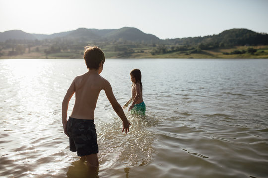 Young boys swimming in lake