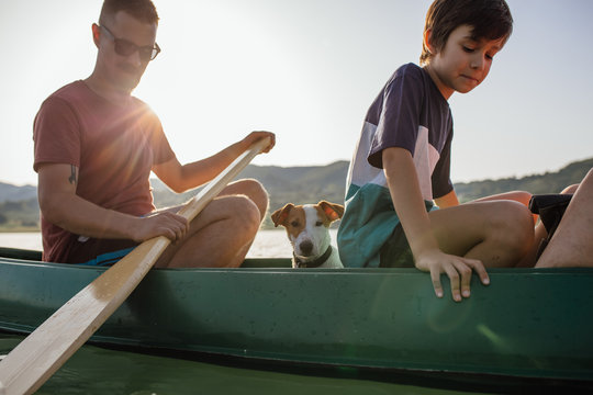 Dad and son canoeing at the lake